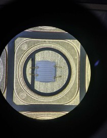 Integrated dam design with ceramic packaging substrate